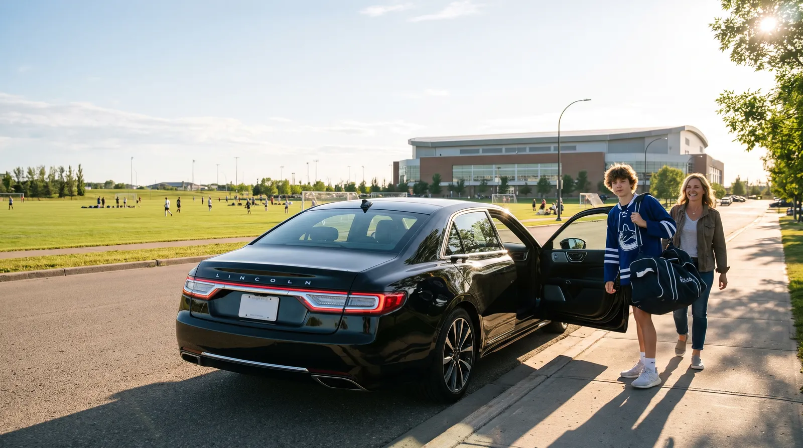 Black Lincoln Continental parked at the curb beside the soccer fields of the National Sports Center in Blaine, Minnesota